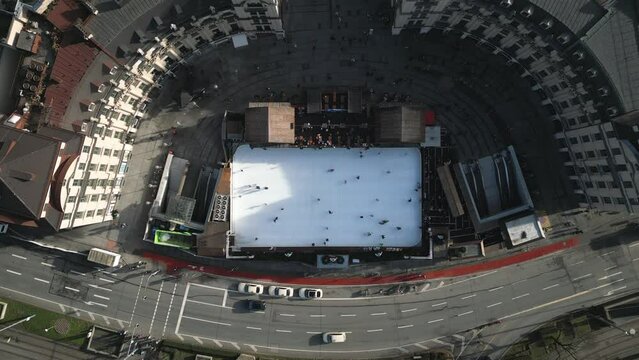 People having fun at Stachus Karlsplatz, Munich, Christmas ice Skating Rink, High quality Arial 4k footage