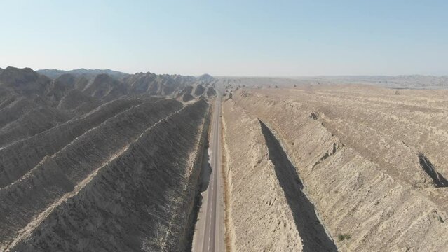 Aerial View Over N10 Makran Coastal Highway Road With Dramatic Rock Formations On Either Side In Hingol National Park. Parallax Shot
