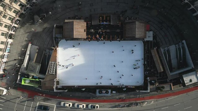 People having fun at Stachus Karlsplatz, Munich, Christmas ice Skating Rink, High quality Arial 4k footage