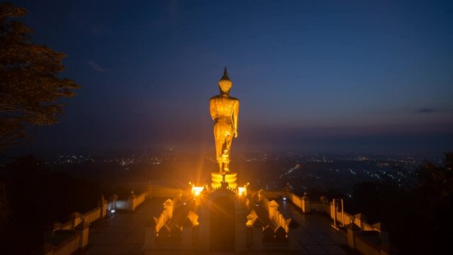 Aerial view Time Lapse of The Golden buddha in sunrise at Wat Phra That Kao Noi in Nan Province , Thailand. Time Lapse Sunrise Buddha and Sea of Fog