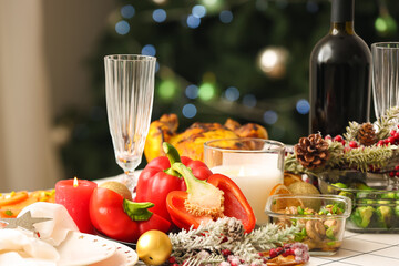 Christmas table setting with fir branches in dining room, closeup