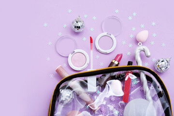 Composition with bag, cosmetics and Christmas decorations on lilac background