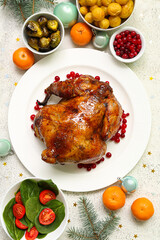 Tasty dishes for Christmas dinner on light background