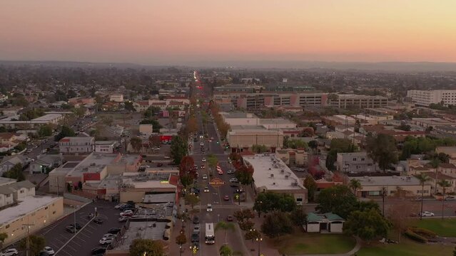 Chula Vista, California. Drone flight over Third Avenue with illuminated Third Avenue Sign.
