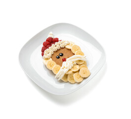 Plate with Santa Claus made of pancake, fruits and whipped cream on white background