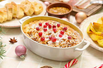 Different tasty dishes for Christmas dinner on table