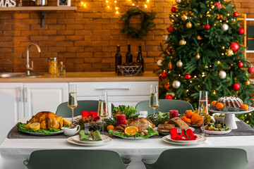Different tasty dishes for Christmas dinner on table