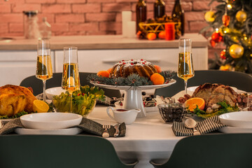 Different tasty dishes for Christmas dinner on table