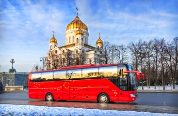 Foto op Canvas Red bus "Unforgettable Moscow" on the Prechistenskaya embankment of the Moscow River, Cathedral of Christ the Savior, Moscow © yulenochekk