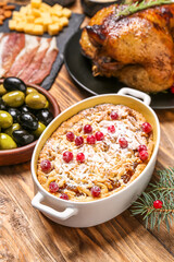 Christmas table setting with tasty pie on wooden background, closeup