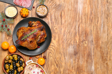 Christmas table setting with tasty meat on wooden background