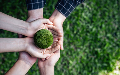 Top View Hands of People Embracing a Handmade Globe for Protecting Planet Together in World Earth...