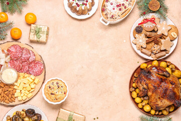 Frame made of tasty food and Christmas gift on beige background