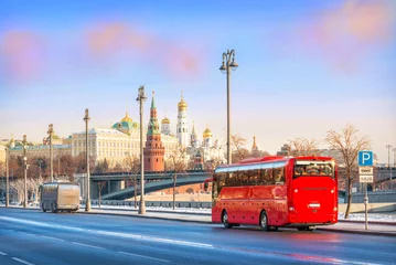 Foto op Canvas Red bus "Unforgettable Moscow" on the Prechistenskaya embankment of the Moscow River and a view of the Kremlin, Moscow © yulenochekk