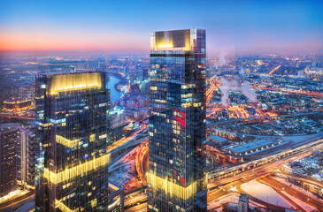 View of the city from the observation deck Panorama 360 to skyscrapers in the light of night lights, Moscow City Federation Tower, Moscow