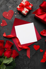 Blank letter with roses, gifts and hearts on dark background. Valentine's Day celebration