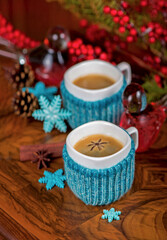 Obraz na płótnie Canvas coffee with cardamom. winter drink. Coffee in cups with cardamom and white sugar on vintage wooden background