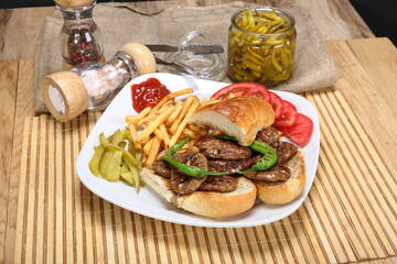 grilled meatballs with fries and tomatoes