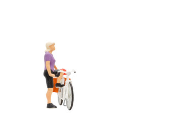 Fototapeta na wymiar Miniature people , Cyclist with a saddle bag isolated on white background with clipping path
