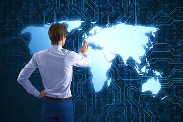 Back view of businessman using creative digital futuristic circuit map hologram on blue background....