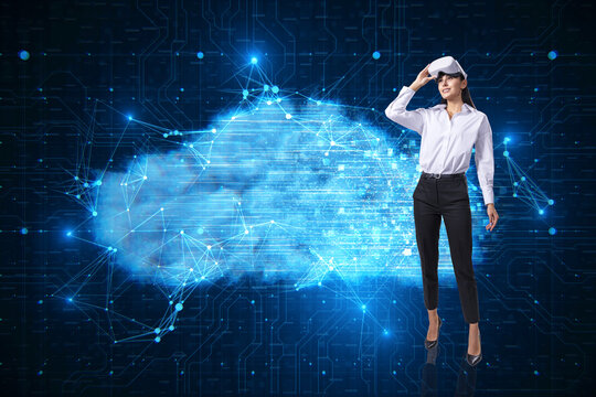 Attractive young european businesswoman with VR glasses and digital glowing polygonal cloud mesh on blurry background. Storage technology concepts transfer data to cloud computing platforms.