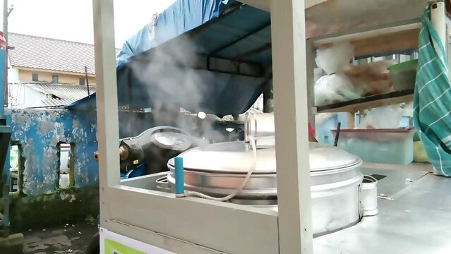 steam meatballs in the rombong of itinerant meatball vendors