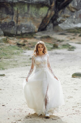 Fototapeta na wymiar Beautiful bride in white dress posing.