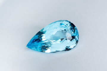 Natural Swiss blue topaz gemstone loose faceted setting for making jewelry. Drop shaped. Front...