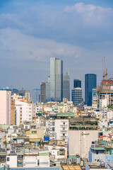 Fototapeta premium Ho Chi Minh City, Vietnam - December 20, 2022: Beautiful afternoon in District 1, Ho Chi Minh City, known as Saigon, a developed city of Vietnam with many skyscrapers. View to Bitexco, Landmark 81.