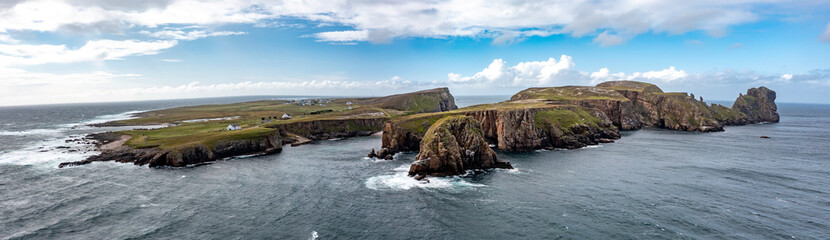 The cliffs and sea stacks An Tor Mor and the Wishing Stone at Port Challa on Tory Island, County Donegal, Ireland © Lukassek