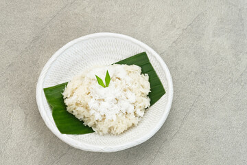 Ketan Kelapa Parut, Indonesian traditional snack, made from steamed glutinous rice and served with grated coconut

