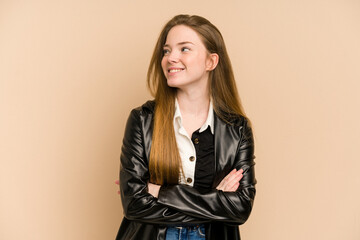 Young redhead woman cut out isolated smiling confident with crossed arms.