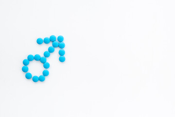 Male sign made of blue pills. Impotence concept. Mans health concept