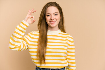 Young redhead woman cut out isolated cheerful and confident showing ok gesture.