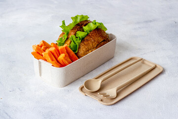 Luch box with sandwiches and bamboo cutlery