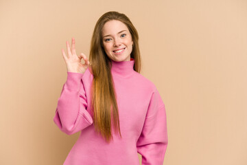 Young redhead woman cut out isolated cheerful and confident showing ok gesture.
