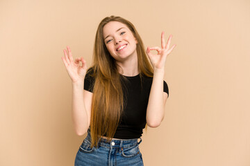 Young redhead woman cut out isolated cheerful and confident showing ok gesture.