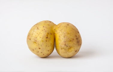 Funny raw potato on white background.