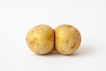 Funny raw potato on white background.