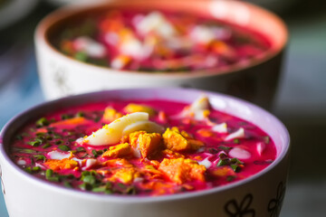 Cold beetroot soup with boiled eggs and greenery