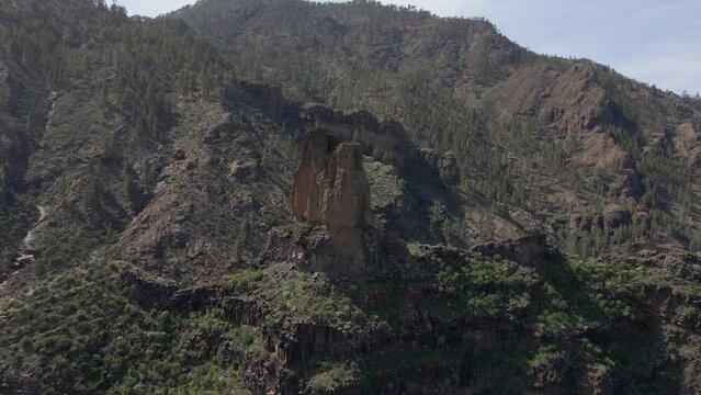 Panoramic aerial shot of Roque Mulato on the island of Gran Canaria on a sunny day.