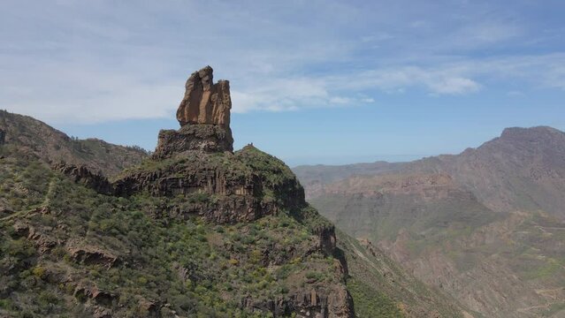 Aerial shot in approach to Roque Mulato on the island of Gran Canaria on a sunny day.
