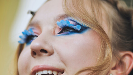 Original makeup for the model. Flower petals on the lashes.