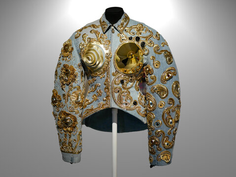 High fashion : Elsa Schiaparelli collection. Jean jacket embroidered with sequins, pearls; conical chest
