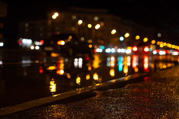 asphalt road in the night city after the rain