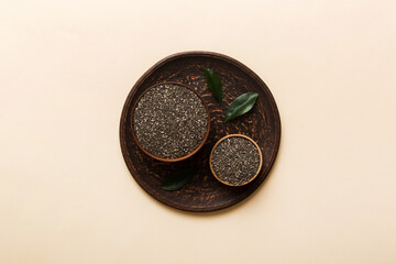 Chia seeds in bowl on colored background. Healthy Salvia hispanica in small bowl. Healthy superfood