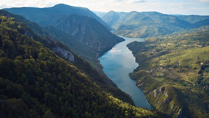 Drone aerial footage of river Drina and Tara mountain landscape.. - obrazy, fototapety, plakaty