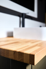 Solid ash glued timber under varnish edge corner table top selective focus macro closeup. Bathroom...