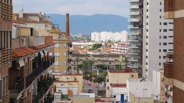 View Of A Large City Buildings With Distant Mountains In Spain