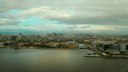 Cityscape of Makati, the business center of Manila, view from above. Asian metropolis at sunset. Travel vacation concept.